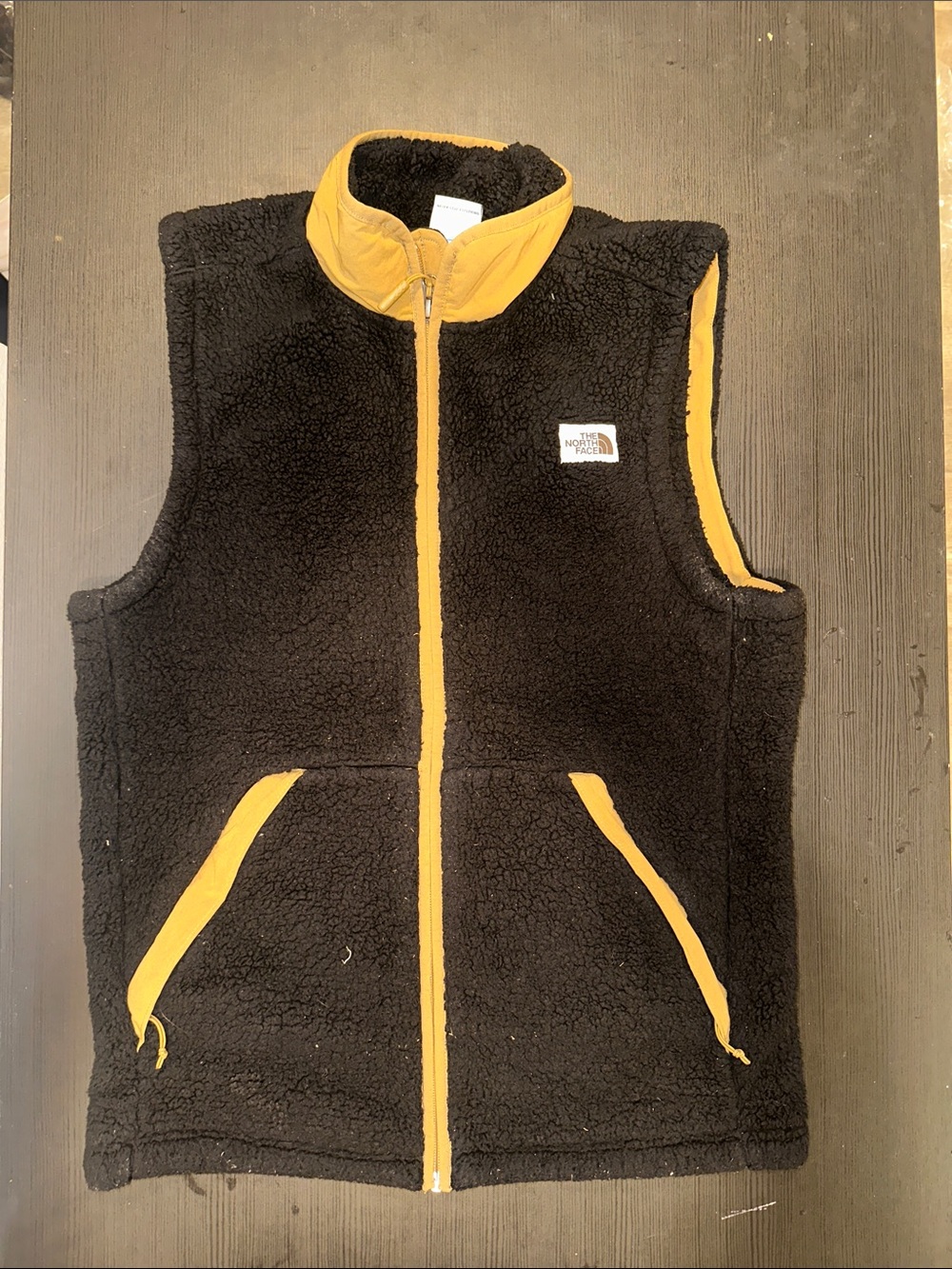 The North Face Kids Black Sherpa Vest with Yellow Trim